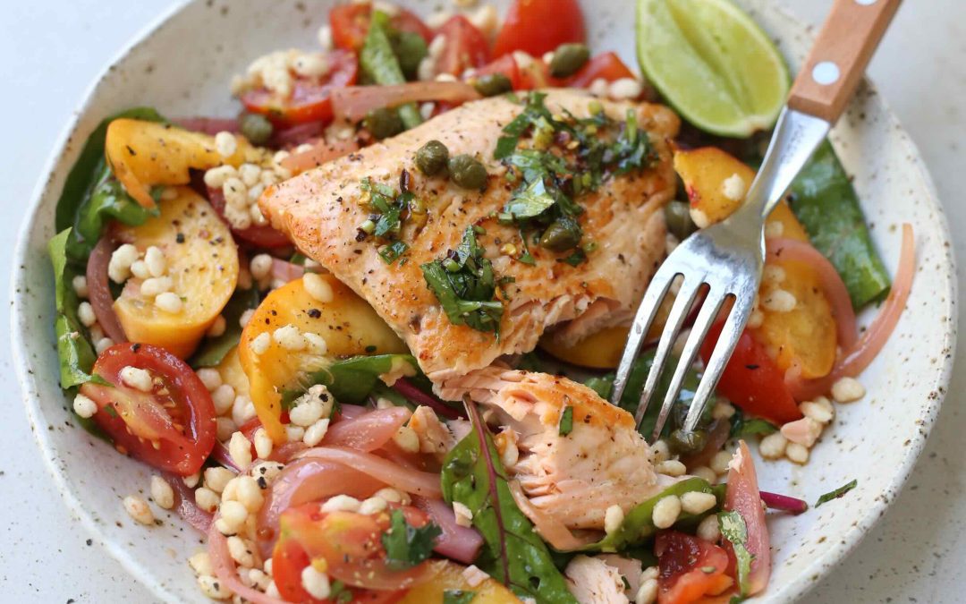 Pan fried salmon with peach tomato and puffed rice salad