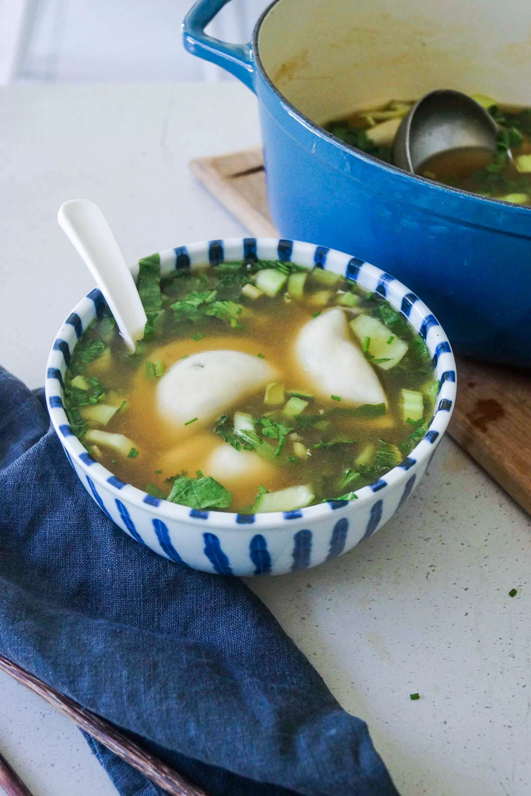 Dumpling soup with lots of greens